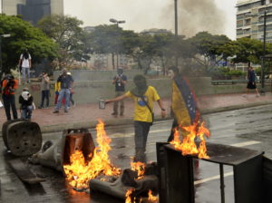 <p>Nicolás Maduro&#8217;s opponents have taken to the streets to protest in recent years. (image:<a href="https://commons.wikimedia.org/wiki/File:Protesta_en_Caracas,_10May14.jpg">WikiCommons)</a></p>