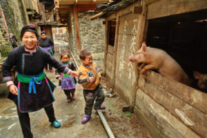 <p>Villagers in Zengchong, Guizhou province (Image: Vladimir Grigorev / Alamy)</p>