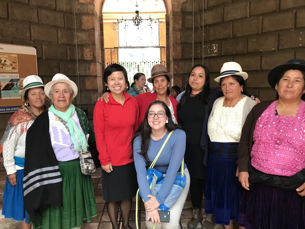 Zhang Jingjing with members of a community affected by the Rio Blanco gold and silver mine near Cuenca, Ecuador.