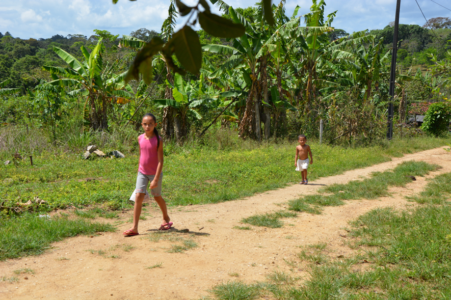Children walking around one of the traditional farms in the region APA
