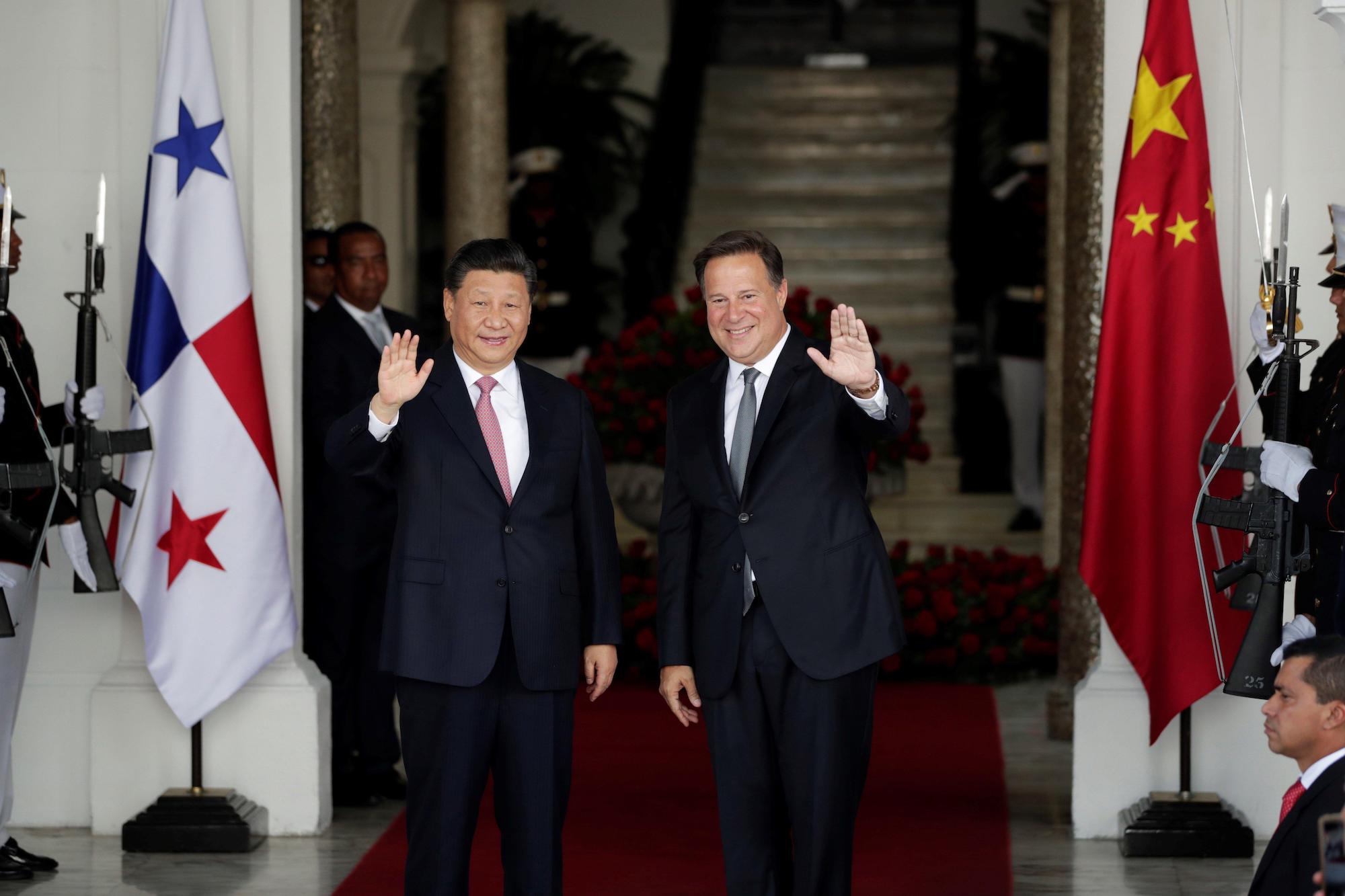 China's President Xi Jinping greets Panama's President Juan Carlos Varela before a meeting at the Presidential Palace in Panama City, Panama