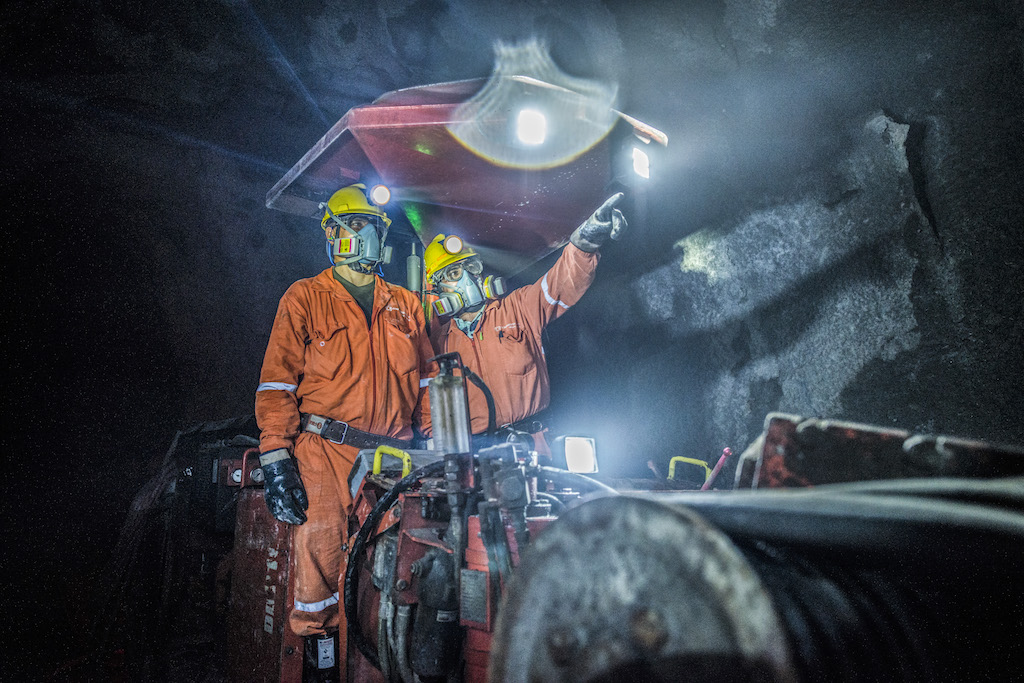 Two employees operating machinery at the Buriticá gold mine operated by Zijin.