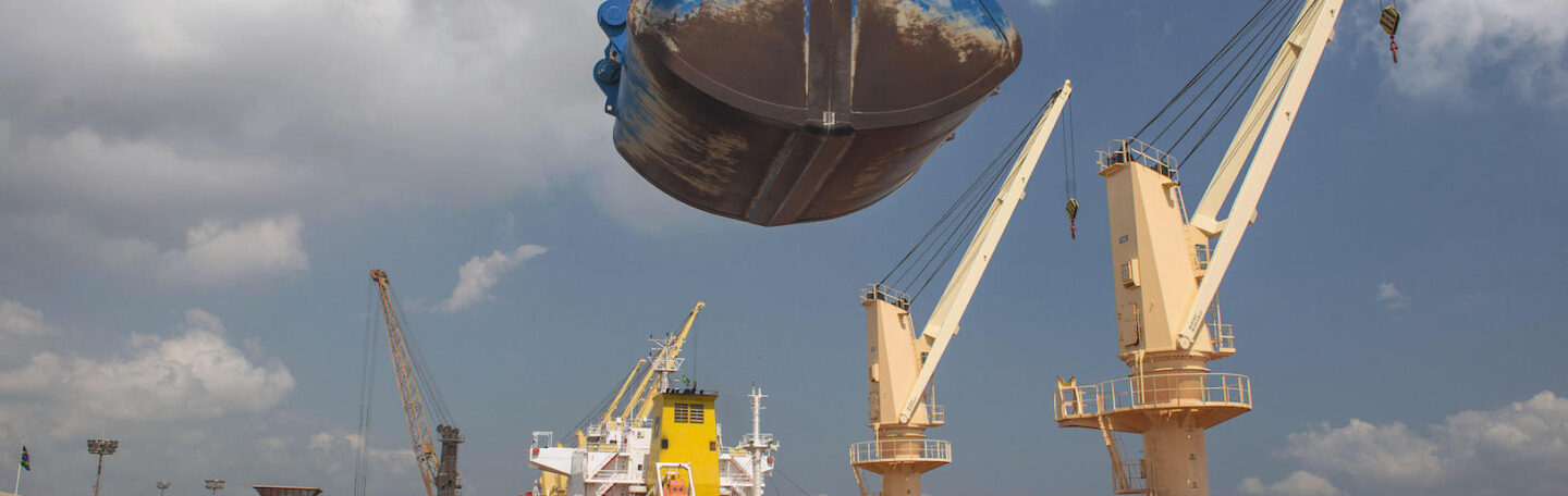 A crane unloads fertiliser at the port of Paranaguá, Southern Brazil