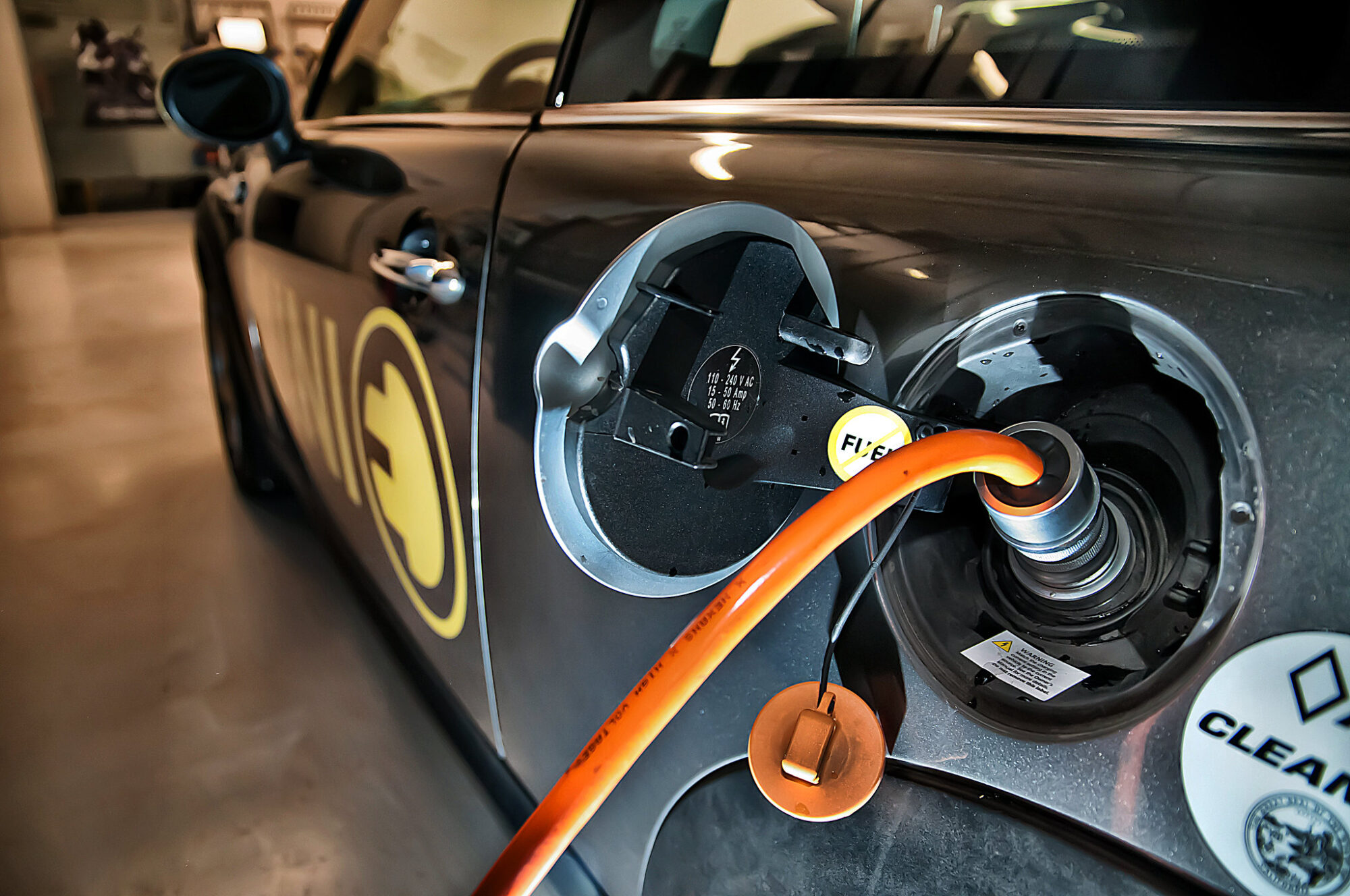 An electric Mini Cooper is seen recharging its battery