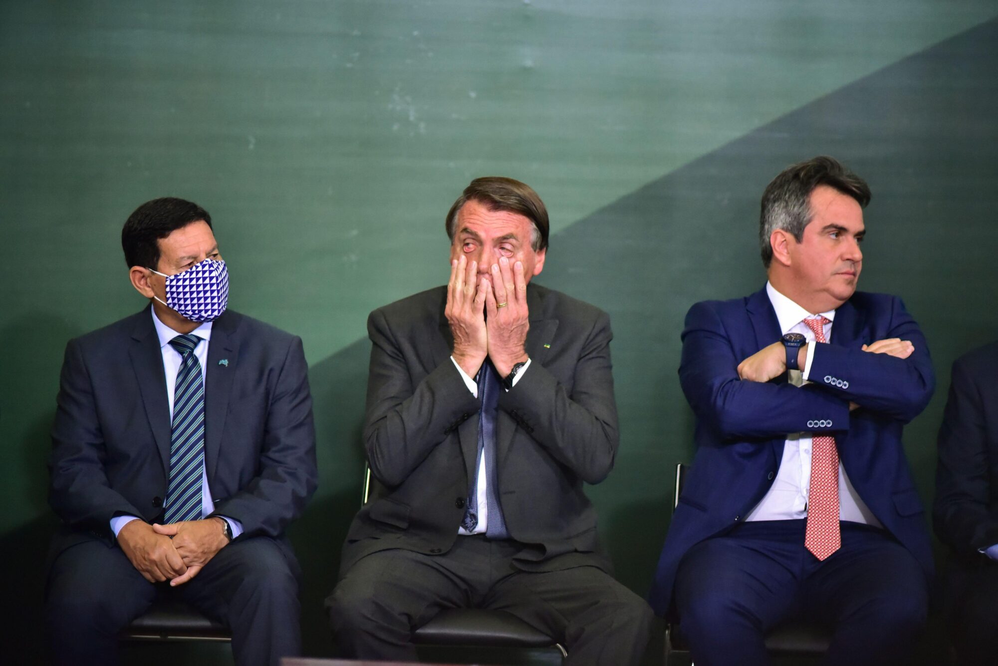 <p>President Jair Bolsonaro sits with vice-president Hamilton Mourão and minister Ciro Nogueira at the launch of the National Green Growth Program on 25 October. Government announcements in the run-up to COP26 have left experts and observers unsatisfied. (Image: Fotoarena / Alamy)</p>