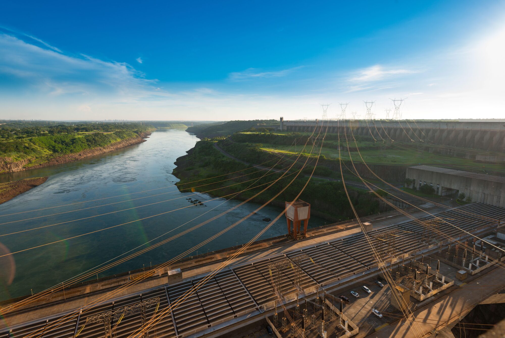 <p>Power lines coming out from Itaipu hydroelectric dam in southern Brazil. This area of the country is expected to face increased rainfall (Image: Jose Luis Stephens / Alamy).</p>