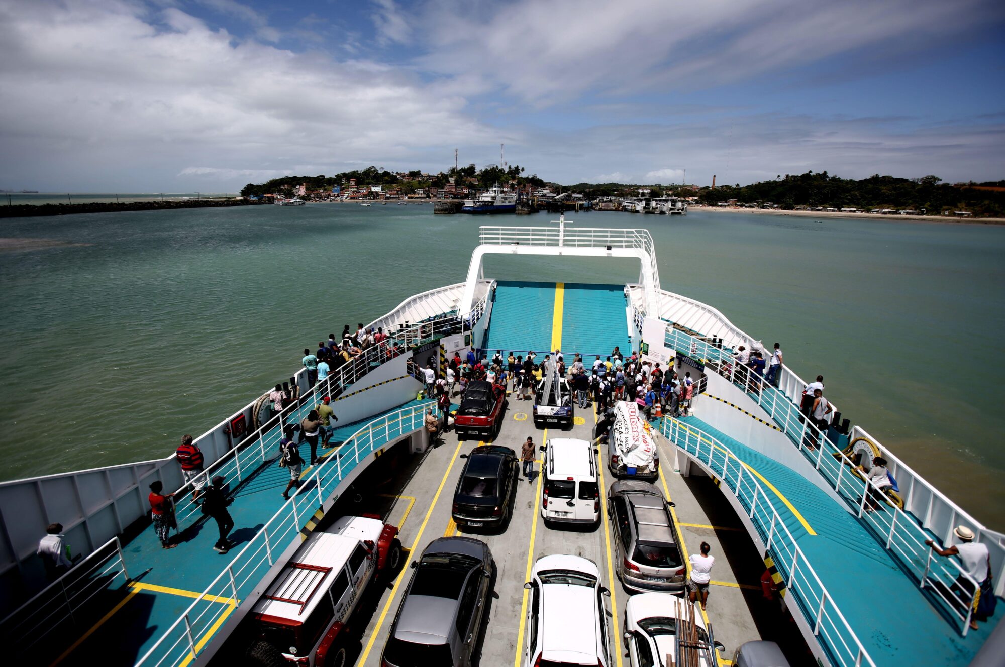 A passenger and car ferry heads towards land in Salvador, Brazil