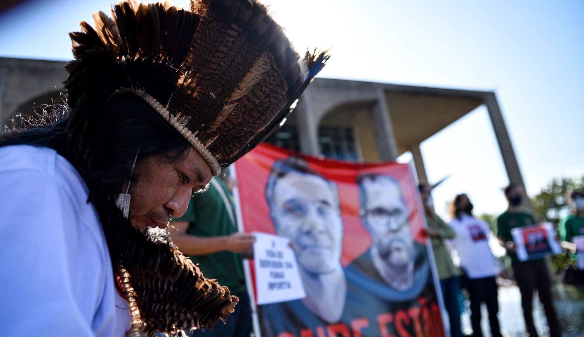 <p>An indigenous protestor demonstrates outside Brazil’s Ministry of Justice in June, following the disappearance of Dom Phillips and Bruno Pereira in the Amazon. Their murders drew global attention to the dangers environmental defenders face in the region (Image: Antonio Molina / Foto Arena / Alamy)</p>