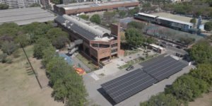 <p>Solar panels on the rooftop and car park of a secondary school in Buenos Aires, Argentina. Many such projects allow users to generate their own electricity and sell surplus back to the grid (Image: Energe)</p>