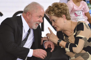Former Brazilian president Dilma Rousseff speaks with current president Lula da Silva