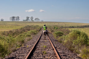 <p>A disused railway in Tambores, northern Uruguay, which used to connect the small town to the capital, Montevideo. A planned green hydrogen plant will bring new industry to this rural area, but has also been met with concern among local residents. (Image: Ramiro Barreiro / Diálogo Chino)</p>