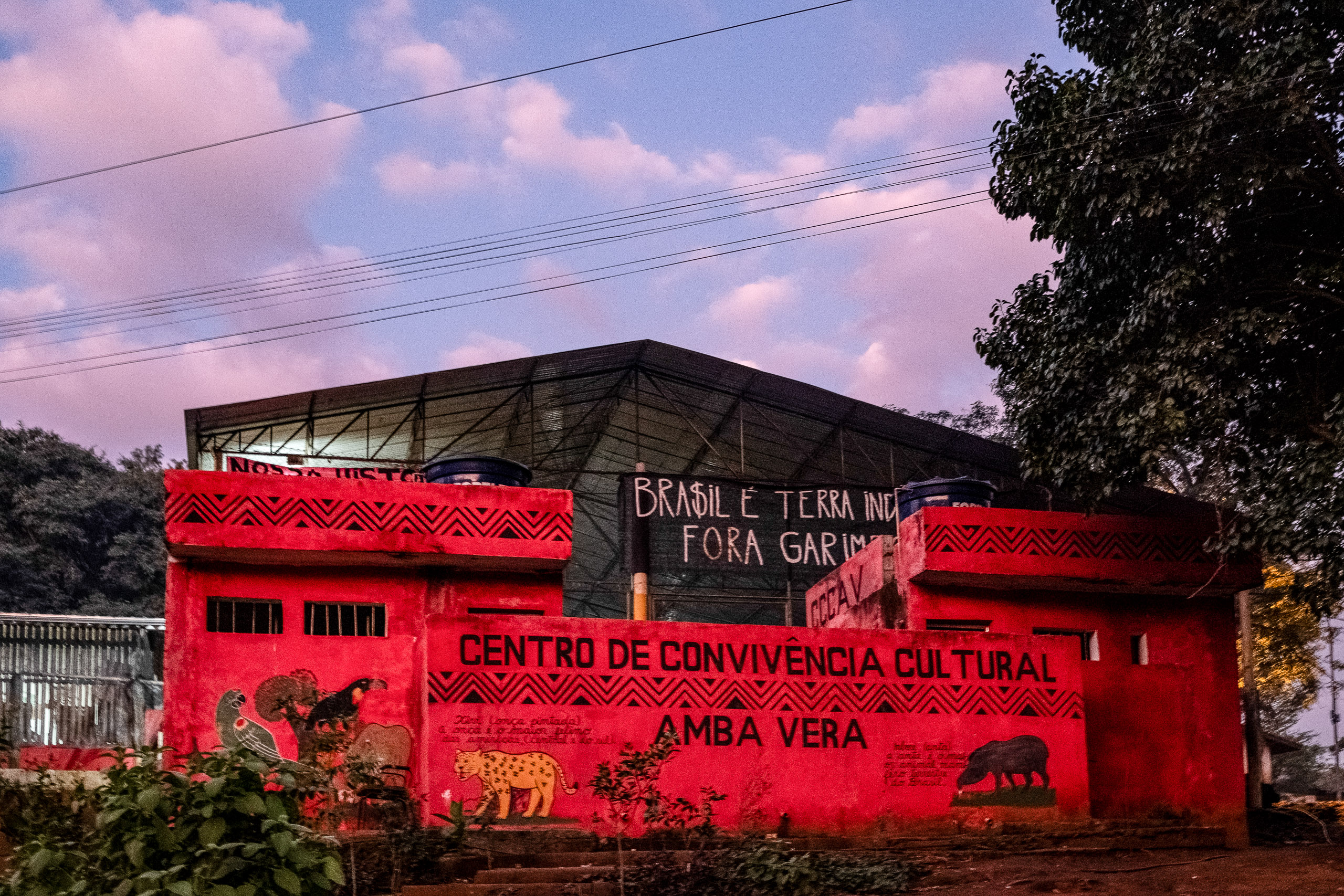 A red building with writing on the outside