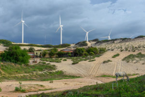 wind turbines in front of a stormy sky, agricultural landscape