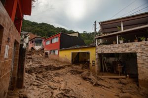 <p>Mud and debris in the streets of Vila Sahy, one of the villages most affected by heavy rains in February this year in São Sebastião municipality, São Paulo state, Brazil (Image: Andre Lucas / Alamy)</p>