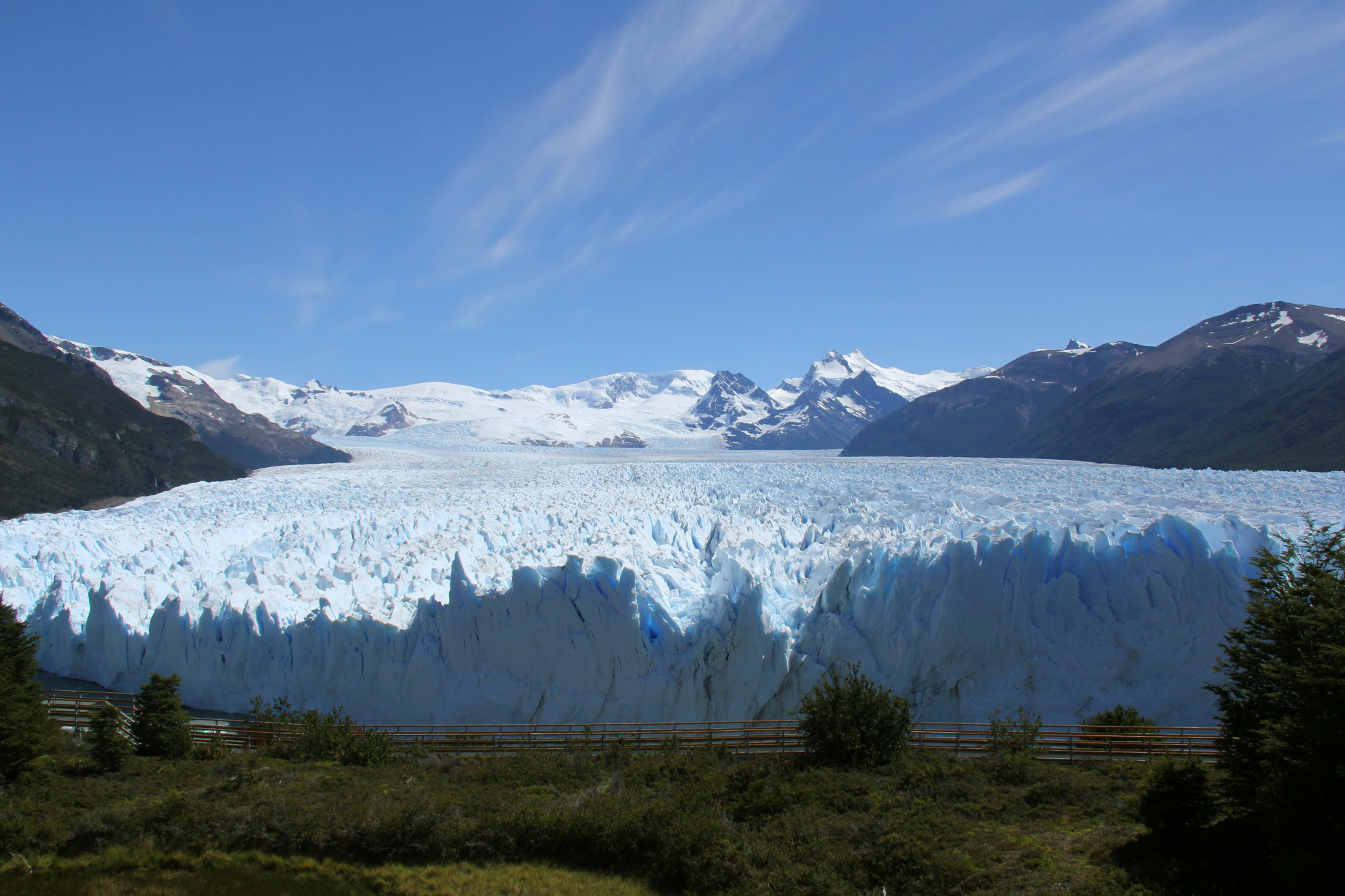A glacier in a mountainous landscape 