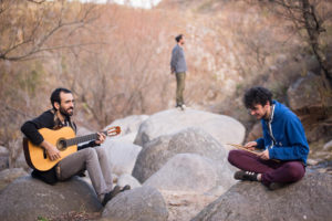 <p>Toch, the band formed by Juan Pablo and Andrés Toch, and Martín Ellena, pictured in the Sierras Chicas mountains, north of the city of Córdoba, Argentina. The group has used their music to raise awareness of Córdoba province’s landscapes and plant life. (Image: Rodrigo Soria / Toch)</p>