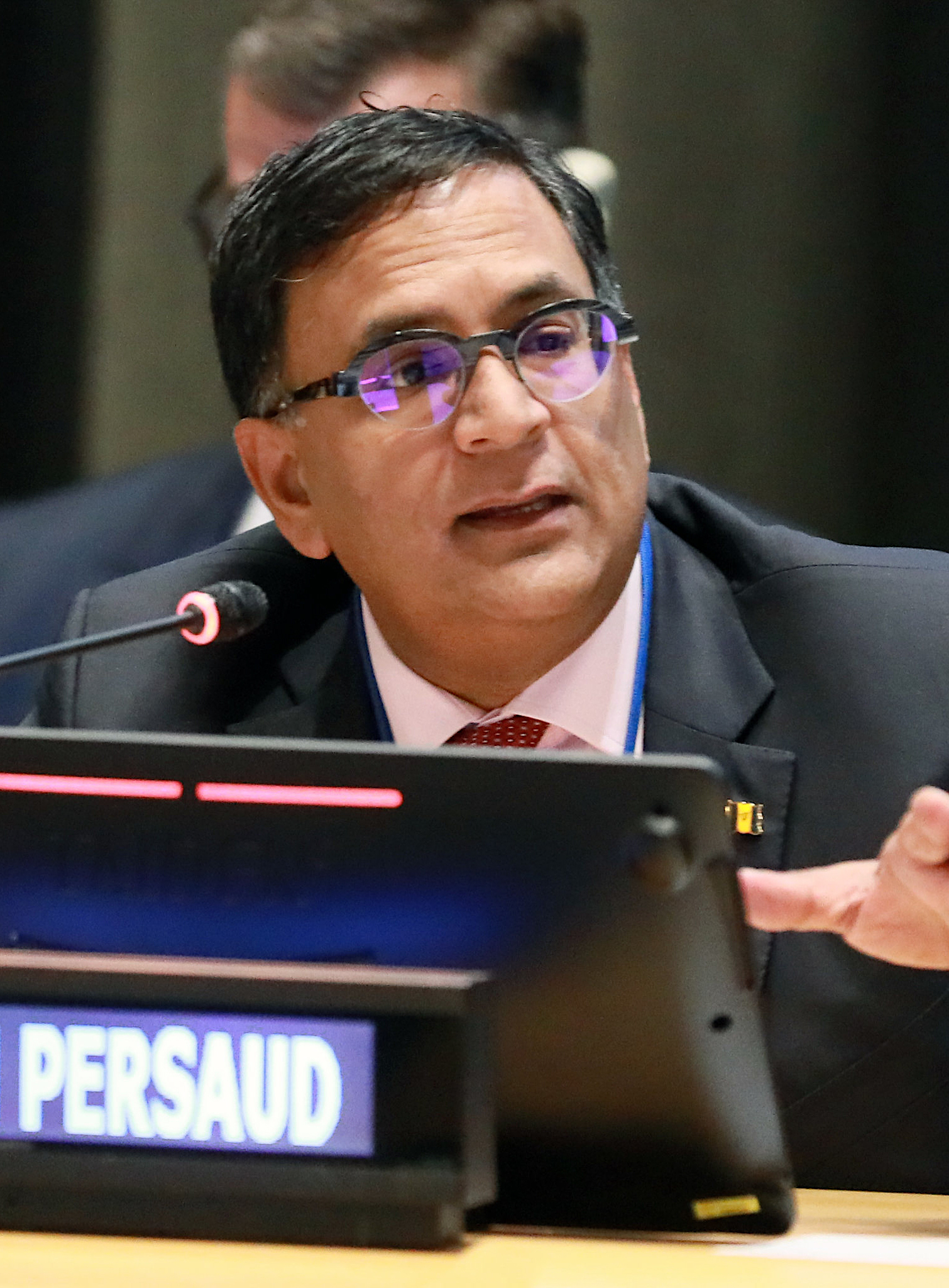 Avinash Persaud speaks at a meeting